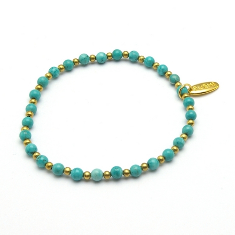 Armband halfedelsteen turquoise met verguld gouden balletjes