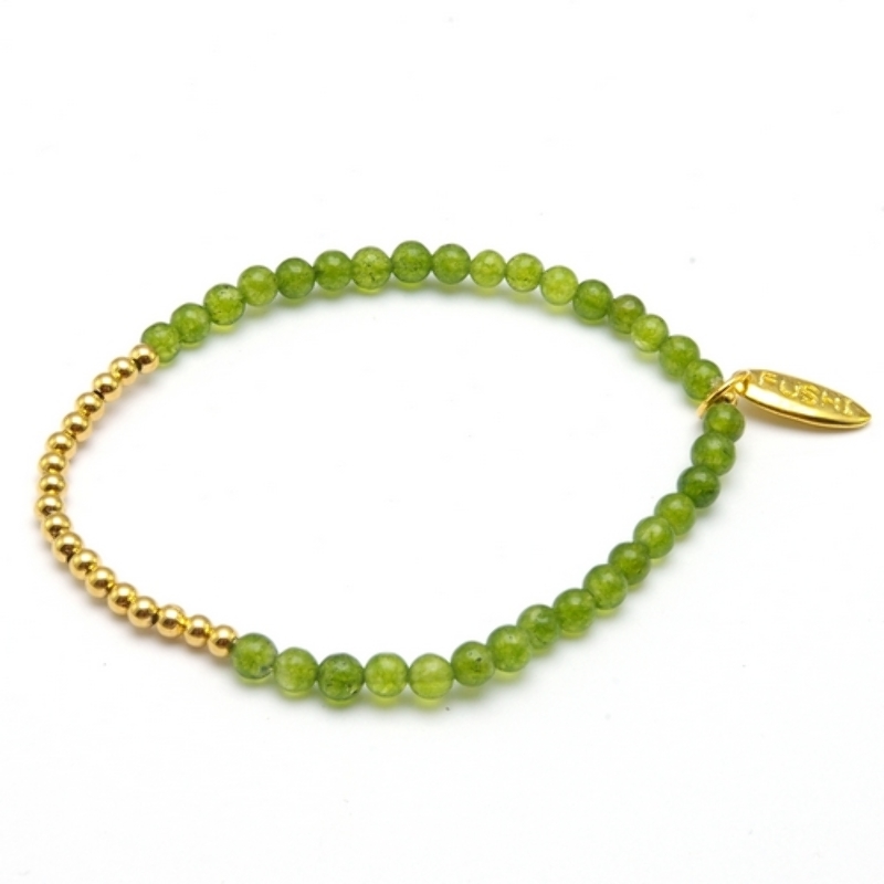 Armband 4mm steenkralen lichtgroen met verguld gouden balletjes
