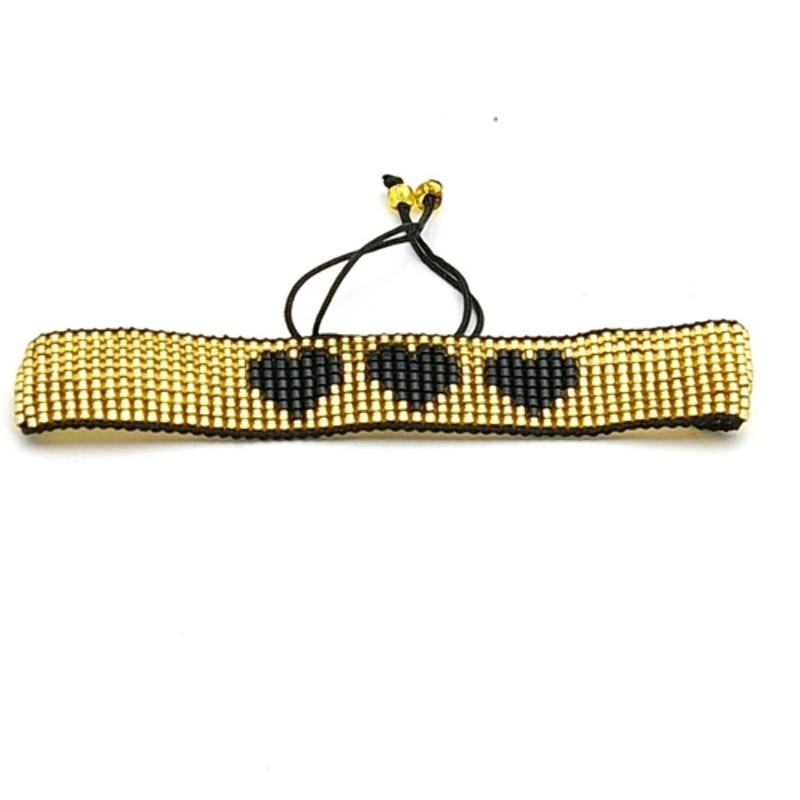 Armband plat geweven mijuki kraaltjes goud met zwarte hartjes