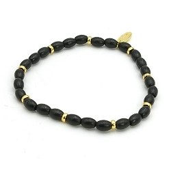 Armband dyed turquoise ovaal zwart en 14krt schijfjes