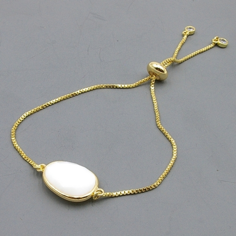 Armband verguld met halfedelsteen ovaal wit